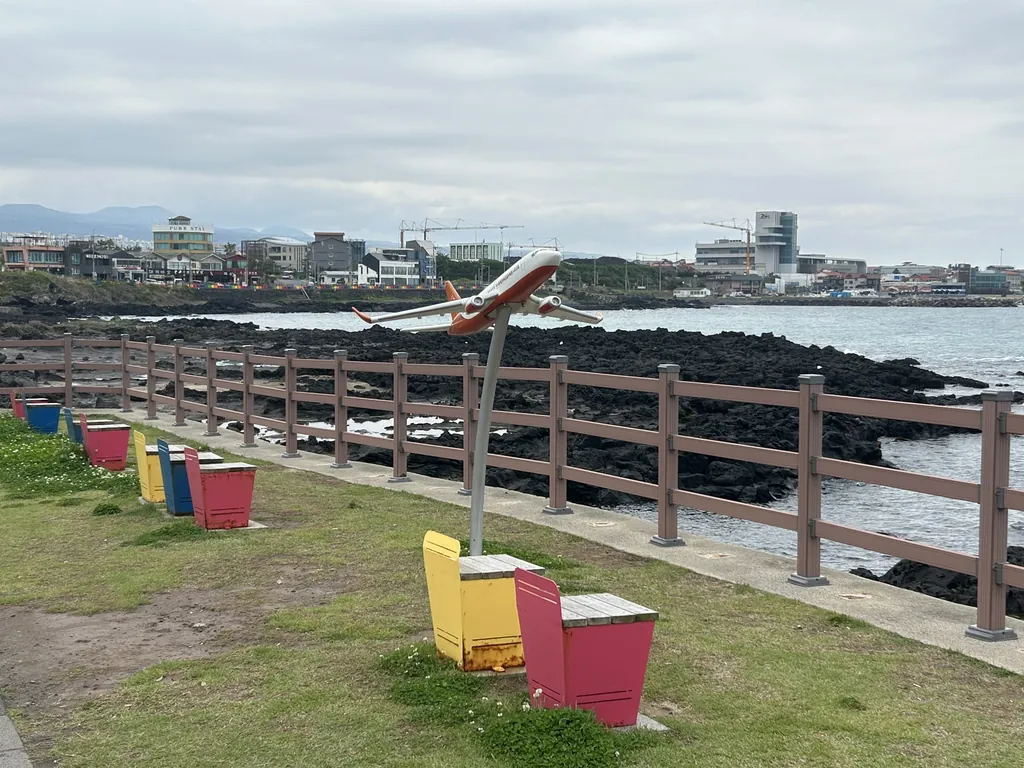 An airplane sculpture on the coastal lawn.