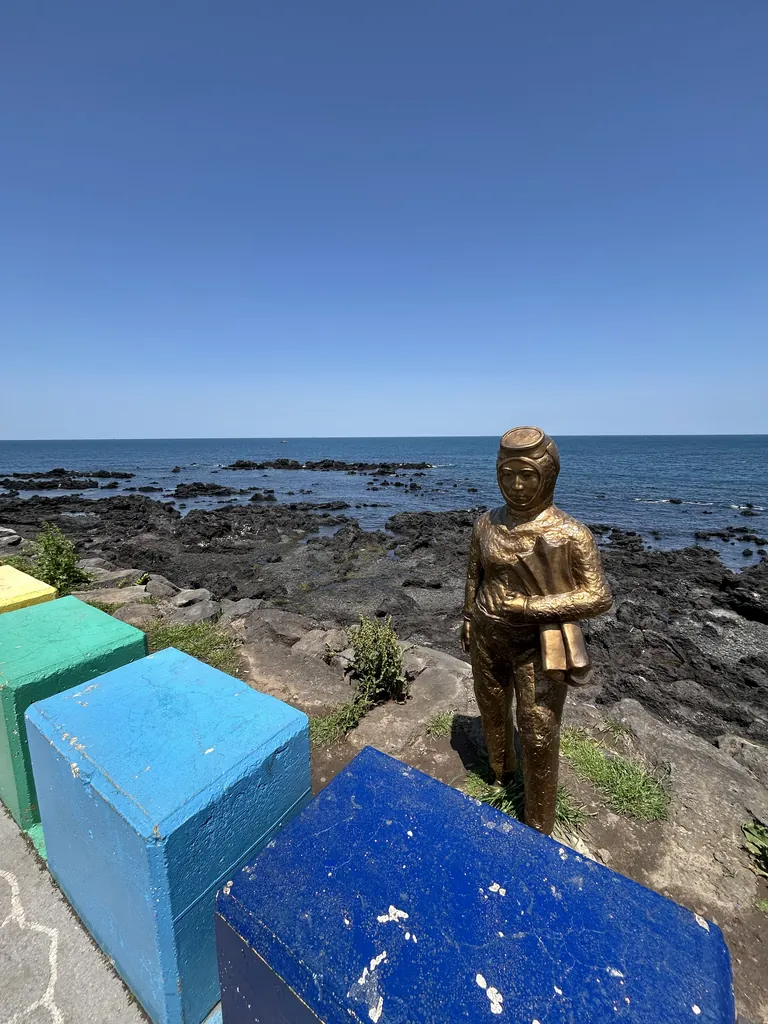 A bronze figure watching over the rocks.