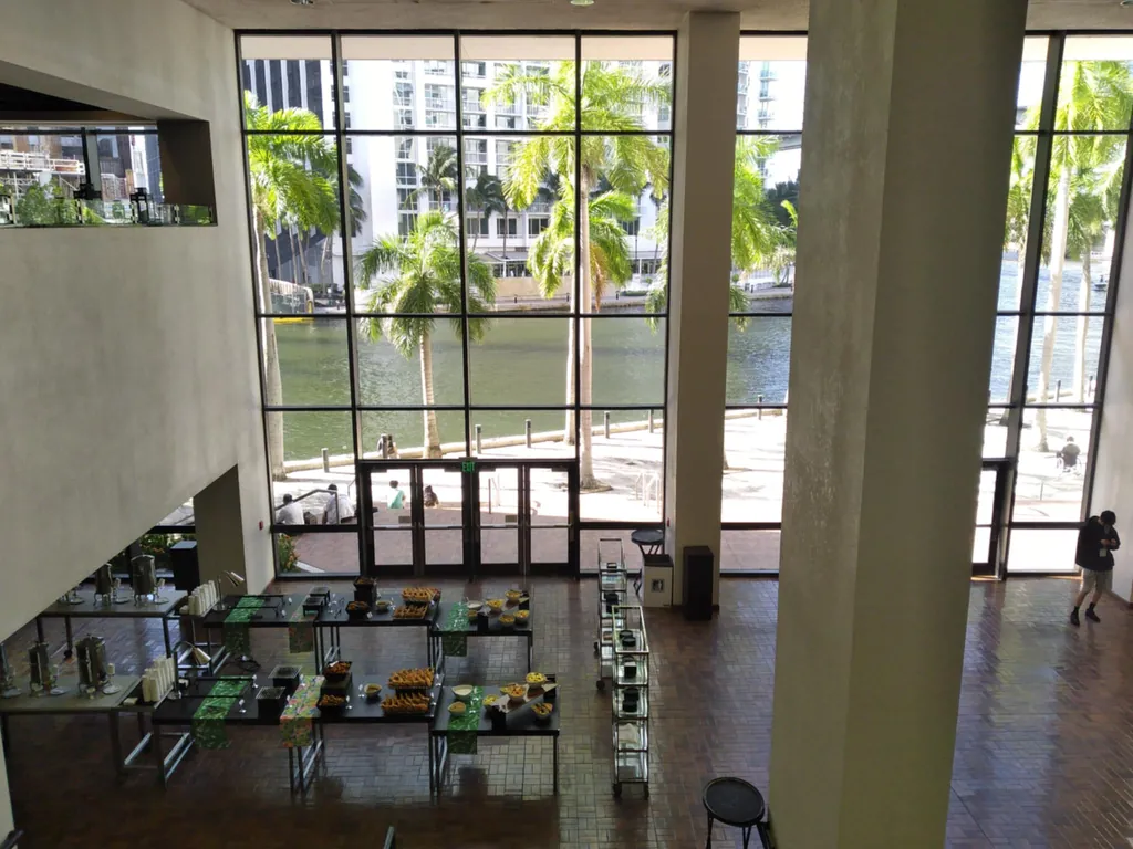 The atrium, with palms and the river beyond.