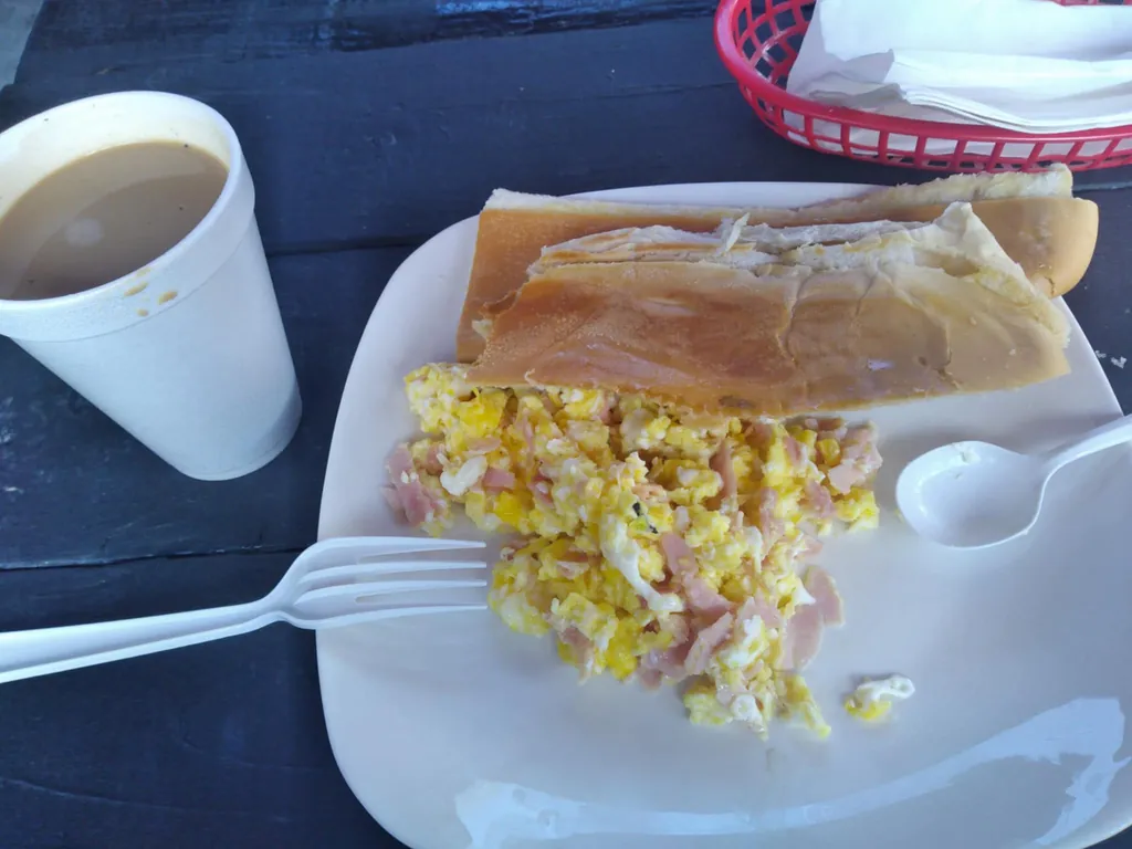 Café con leche, eggs and Cuban bread.