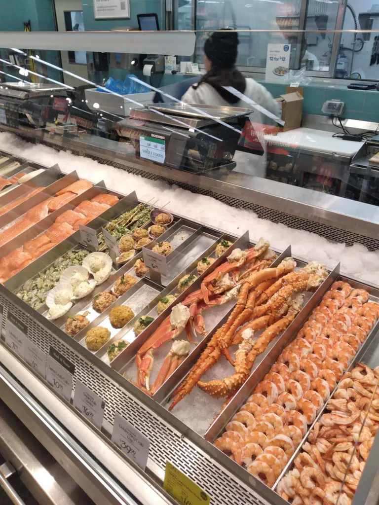 Crab legs and shrimp on ice.