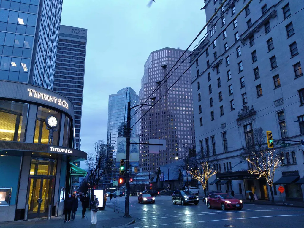 Downtown lights coming on at dusk.